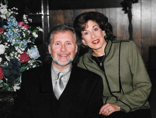 A man and woman posing for a picture.