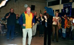 A man and woman dancing in front of an audience.